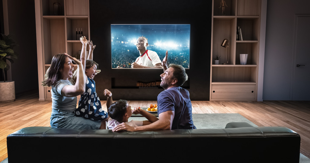 family watching game on a TV